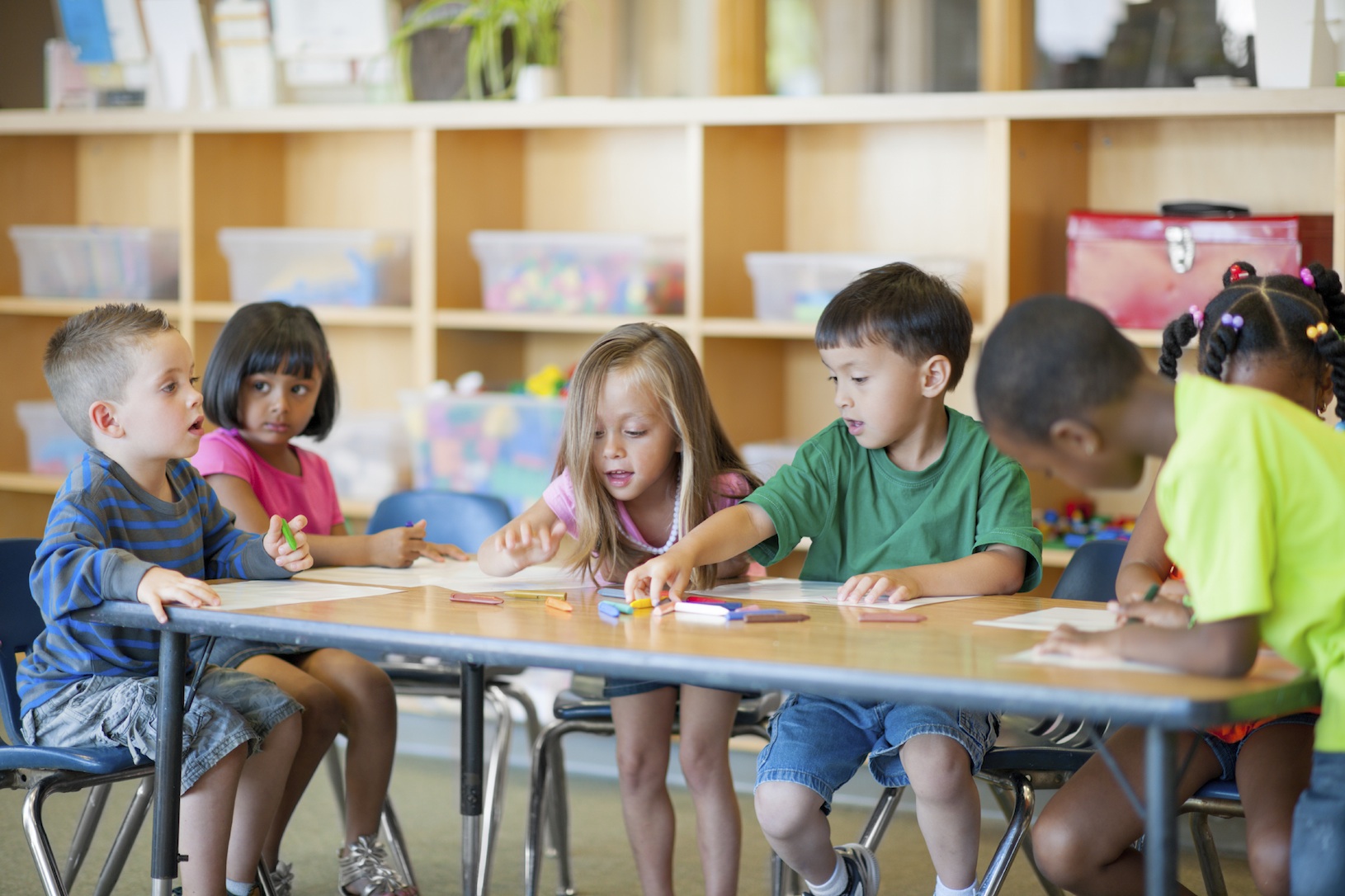 A diverse group of preschoolers in a classroom